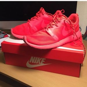 Neon red Nike sneakers